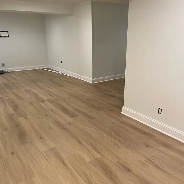 Basement finished with a light luxury vinyl plank floor