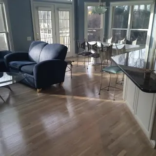 White oak floor in a great room with a wall of windows