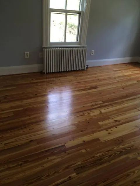 Heart pine floor after restoration, sanded and finished in gloss