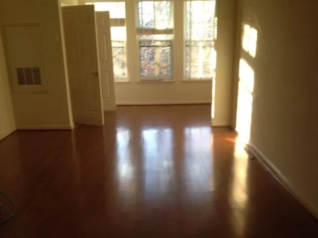 The same room with a finished dark hardwood floor