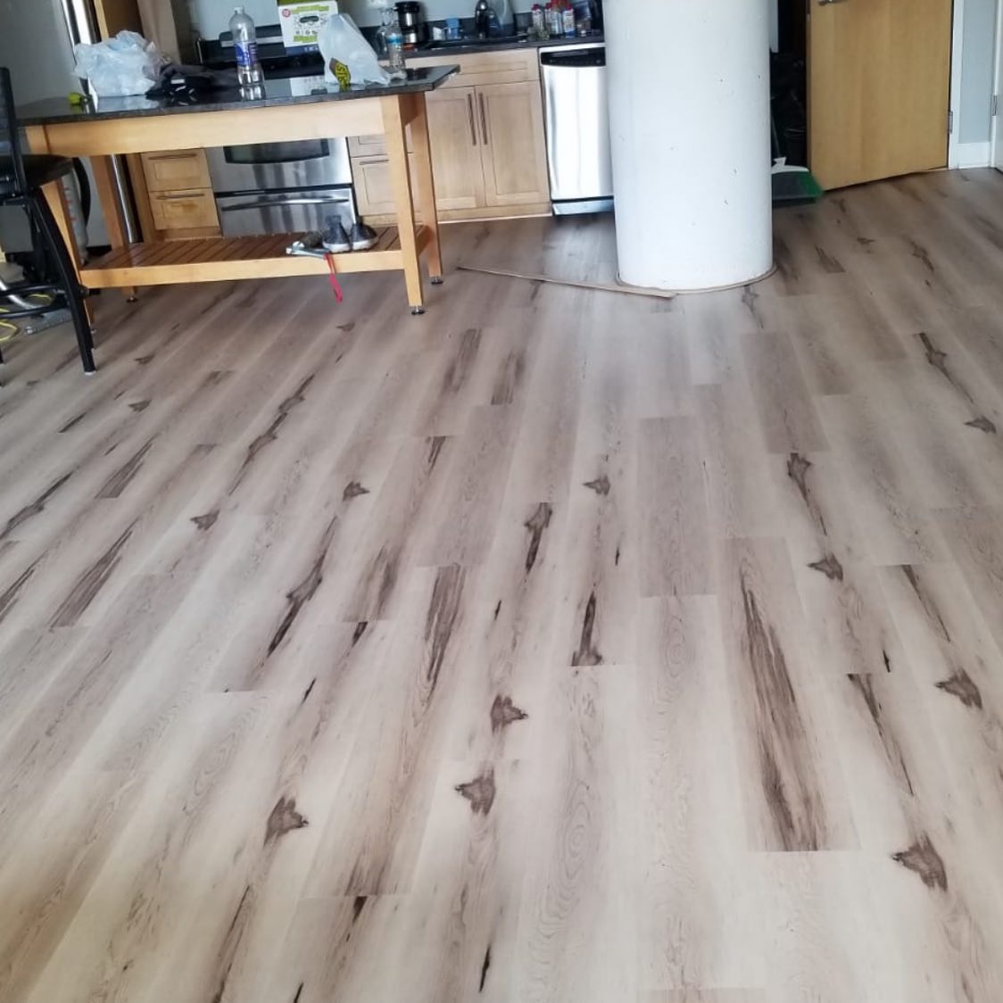 Hardwood Floors in the Kitchen: Pros, Cons, and Waterproof Alternatives